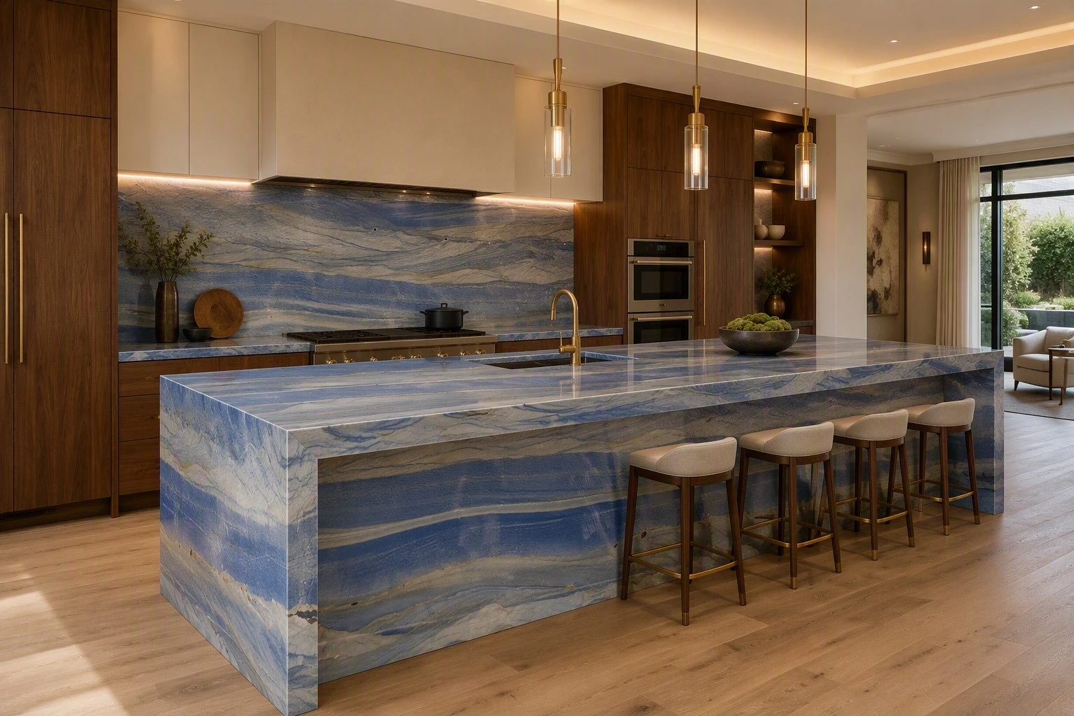 Luxury kitchen featuring Azul Macaubas quartzite countertops, a waterfall island, and a full-height stone backsplash with walnut cabinetry. Luxury kitchen featuring Azul Macaubas quartzite countertops, a waterfall island, and a full-height stone backsplash with walnut cabinetry.