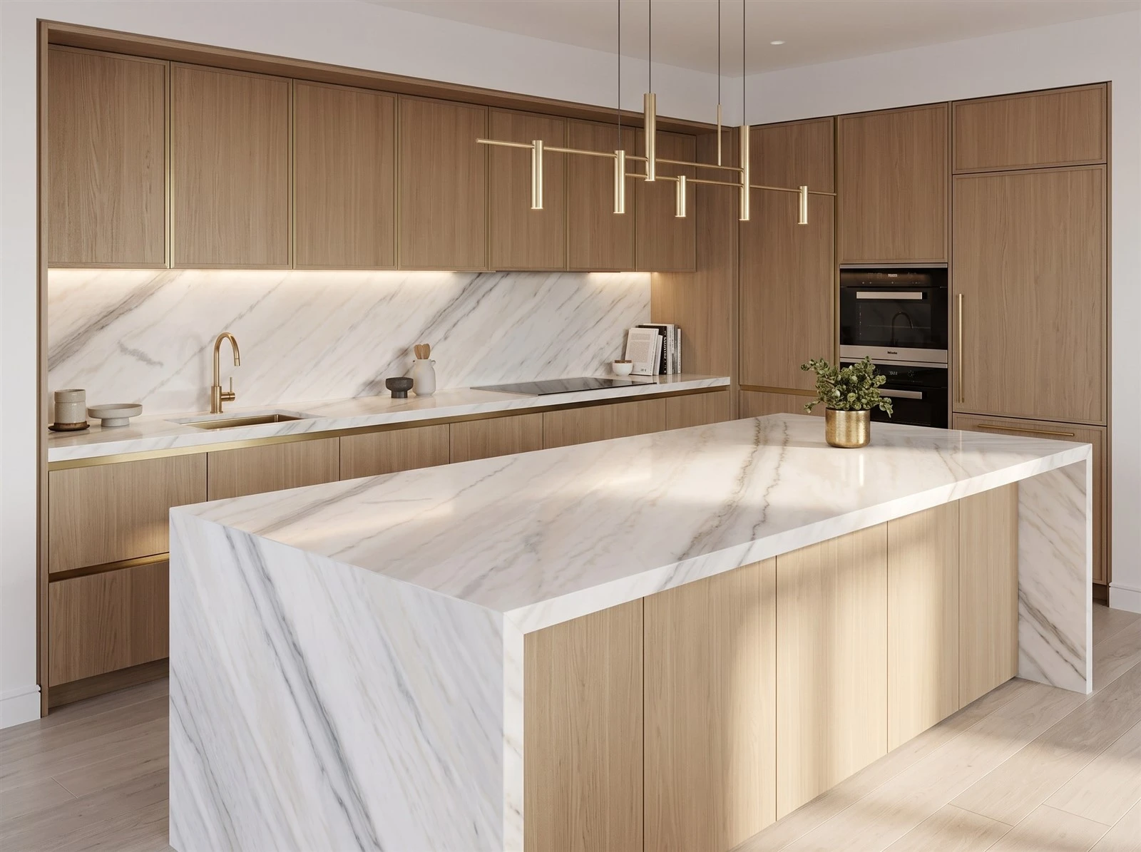 Guangxi White Marble kitchen countertop, backsplash and waterfall island paired with warm oak cabinetry Guangxi White Marble kitchen countertop, backsplash and waterfall island paired with warm oak cabinetry